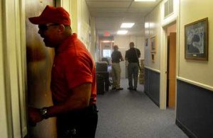 man trying to open door during an active shooter training for business program